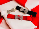 IT'S A CINCH - Belt by Teal Tiger Boutique $9.00 Add some sparkle to your waist with this adorable elastic belt featuring rhinestone bows. It's a cinch to elevate your style! Available in red, white, and black. One size fits small to large. Teal Tiger Bou