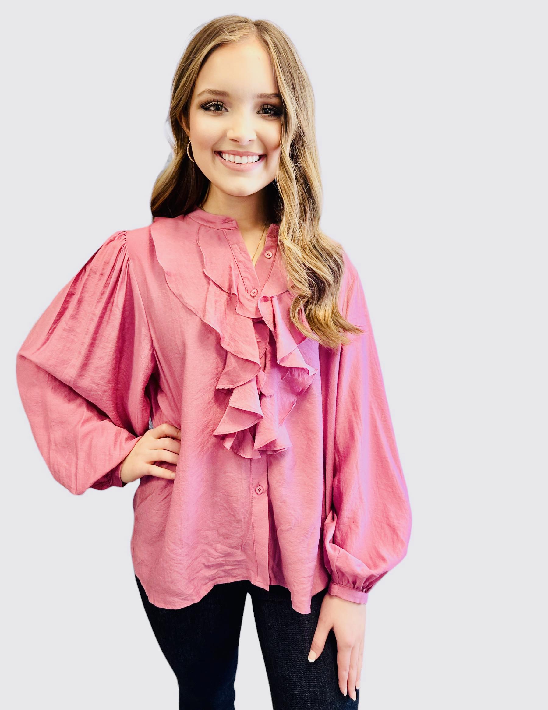 FOUND MY FRILL Top - Easel by Easel $20.00 This silky smooth button-up top exudes luxury, with an abundance of charming ruffle accents. All in a charming shade of pink. By Easel 90% Rayon, 10% Polyester Teal Tiger Boutique