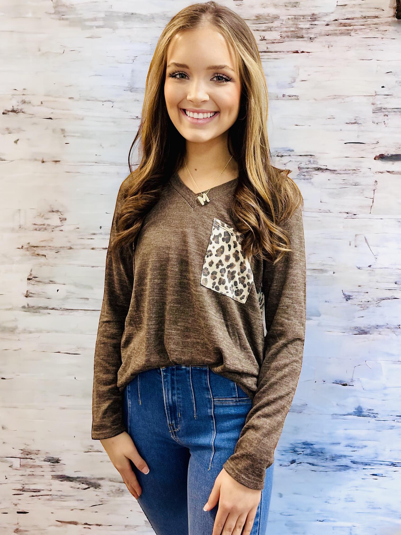 UNTAMED STYLE Top by Hemish in Chocolate by HEMISH $20.00 Embrace a daring style with this bold top featuring a luxe, long-sleeved design. Crafted with expertise, it showcases dynamic color-block elements and a wild animal print on the pocket and back pan