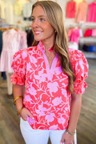 Model wearing the Society Sweetheart Top with floral design and puff sleeves, perfect for stylish summer outfits.