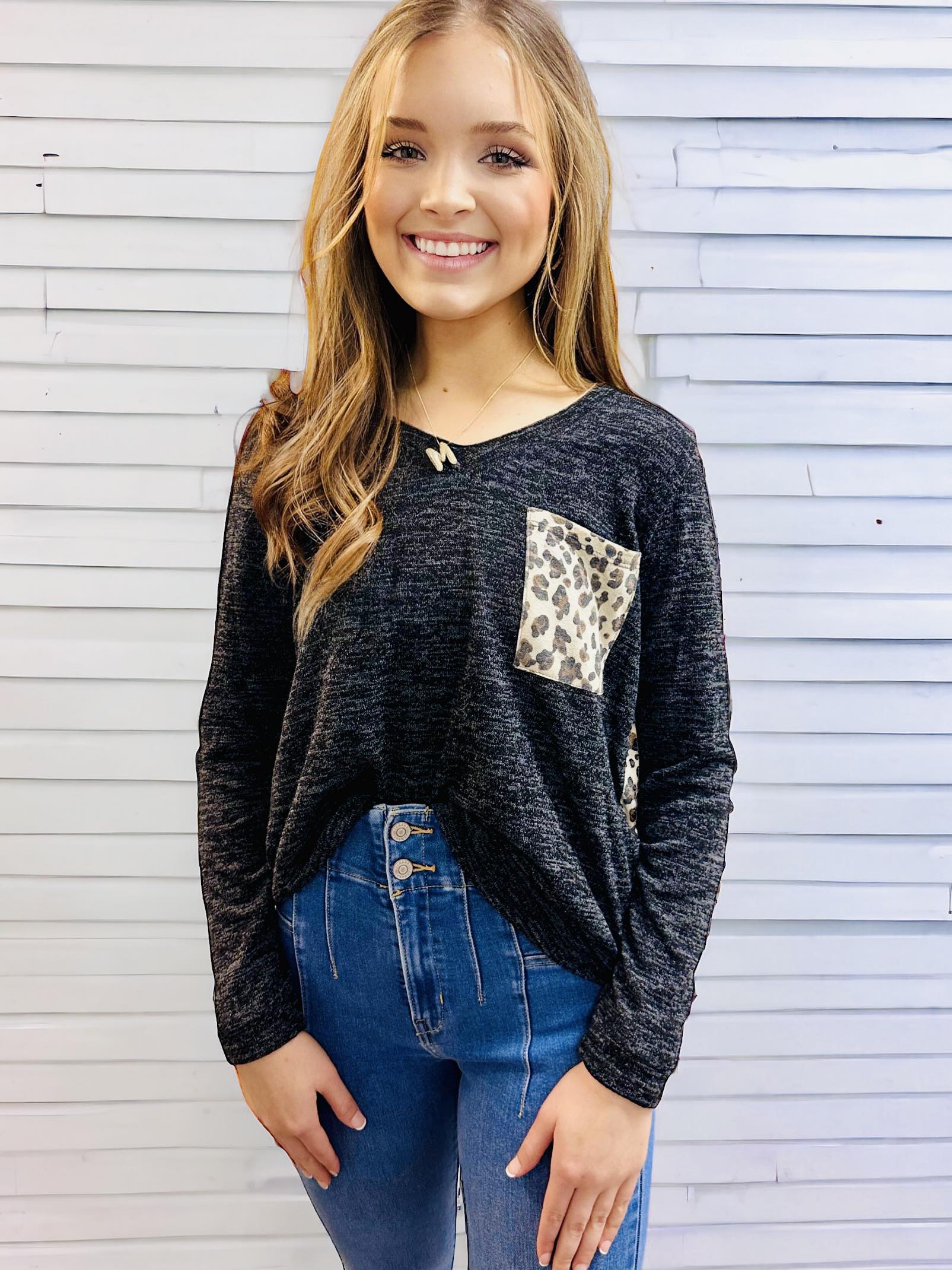 UNTAMED STYLE Top by Hemish in Charcoal by HEMISH $20.00 Embrace a daring style with this bold top featuring a luxe, long-sleeved design. Crafted with expertise, it showcases dynamic color-block elements and a wild animal print on the pocket and back pane