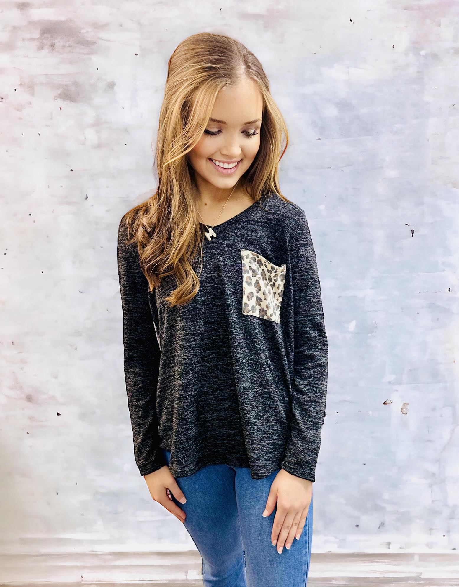 UNTAMED STYLE Top by Hemish in Charcoal by HEMISH $20.00 Embrace a daring style with this bold top featuring a luxe, long-sleeved design. Crafted with expertise, it showcases dynamic color-block elements and a wild animal print on the pocket and back pane