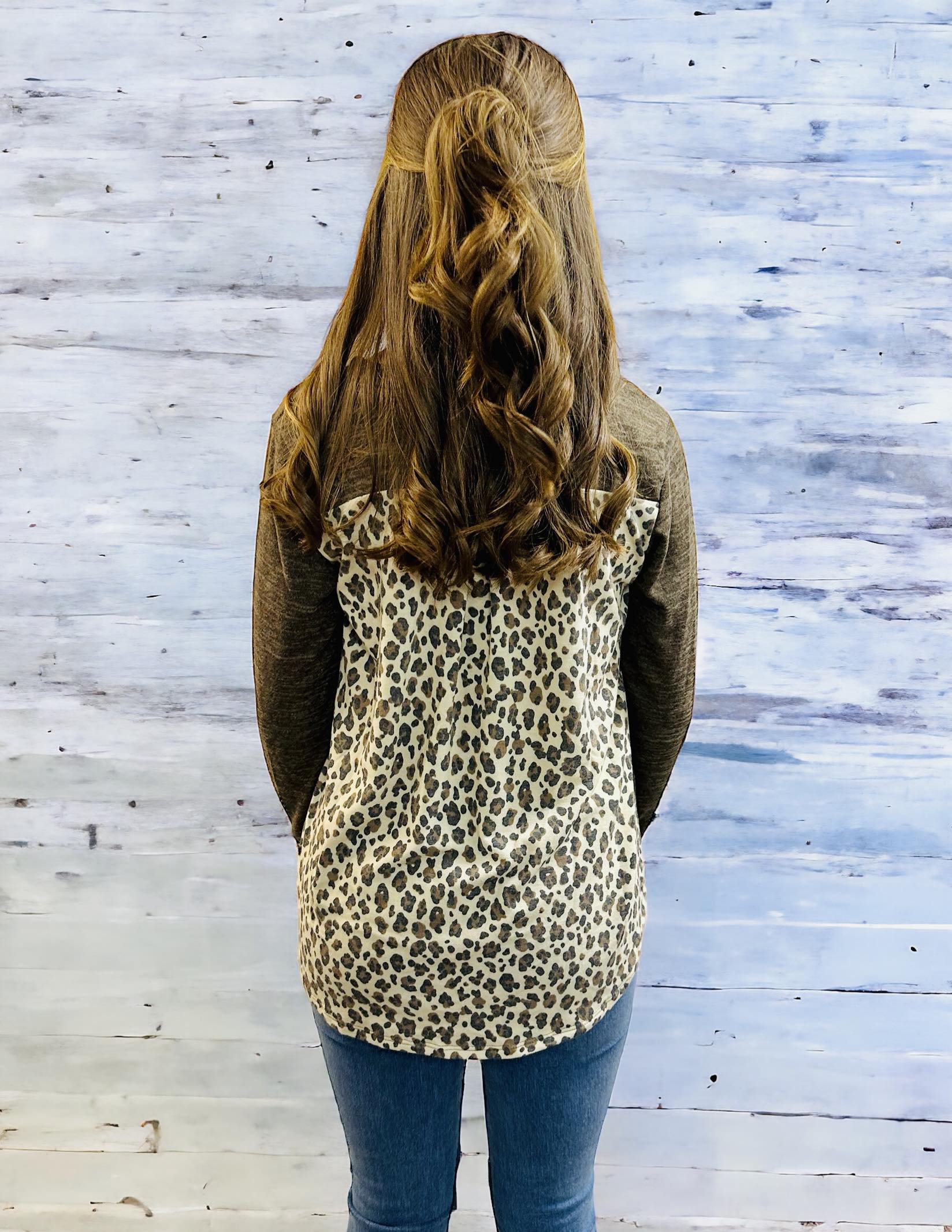 UNTAMED STYLE Top by Hemish in Chocolate by HEMISH $20.00 Embrace a daring style with this bold top featuring a luxe, long-sleeved design. Crafted with expertise, it showcases dynamic color-block elements and a wild animal print on the pocket and back pan