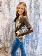 UNTAMED STYLE Top by Hemish in Chocolate by HEMISH $20.00 Embrace a daring style with this bold top featuring a luxe, long-sleeved design. Crafted with expertise, it showcases dynamic color-block elements and a wild animal print on the pocket and back pan