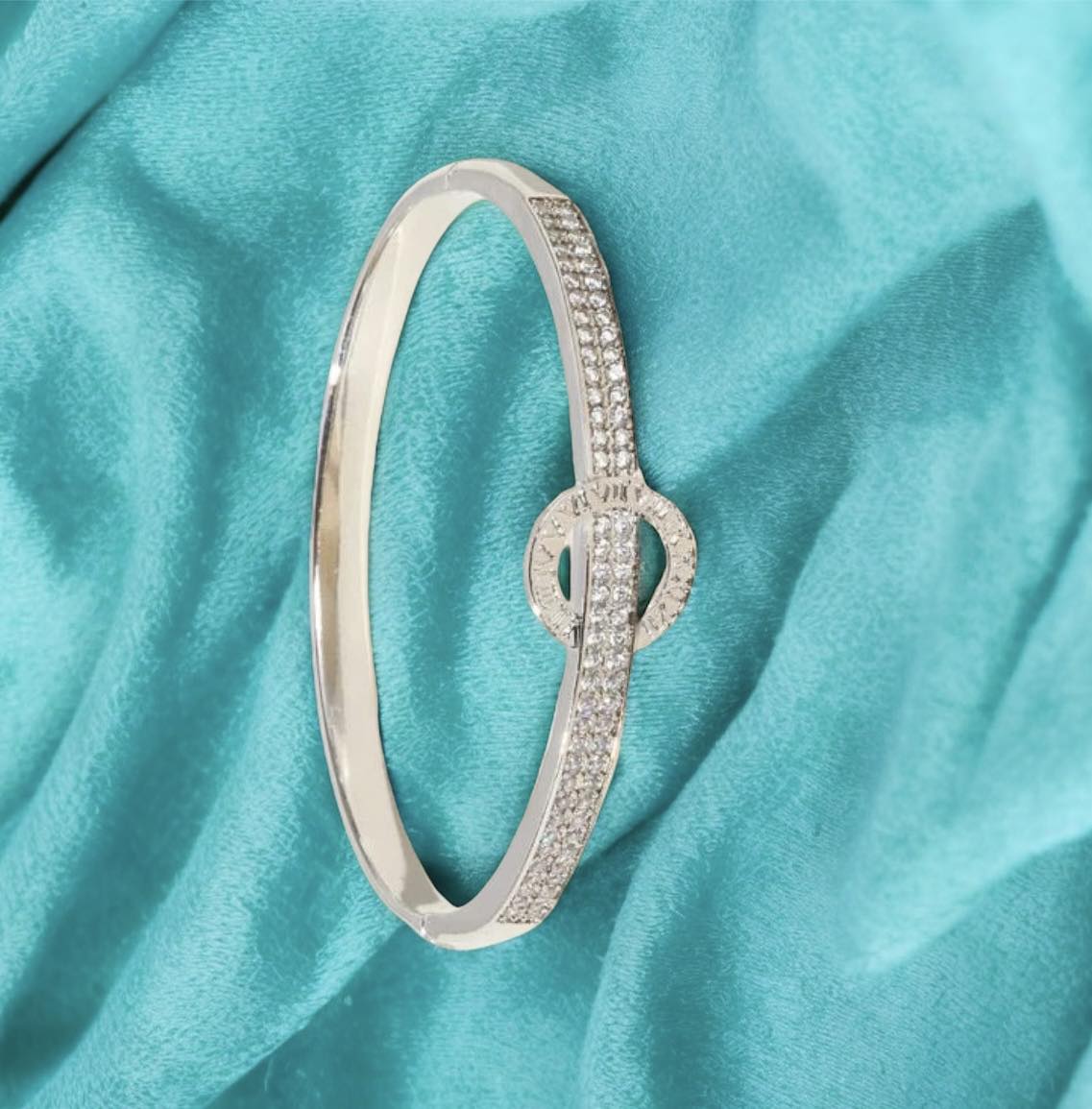 MOMENT IN TIME Bracelet (silver tone) by Teal Tiger Boutique $16.00 The carefully crafted MOMENT IN TIME Bracelet in silver tone features a stunning sundial design, accented with sparkling inlaid rhinestones, for a truly elegant and timeless accessory. T