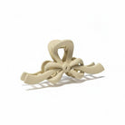 RIBBON REVIVAL HAIR CLIP (7 colors) in soft beige, a stylish matte bow claw clip for effortless hair styling.