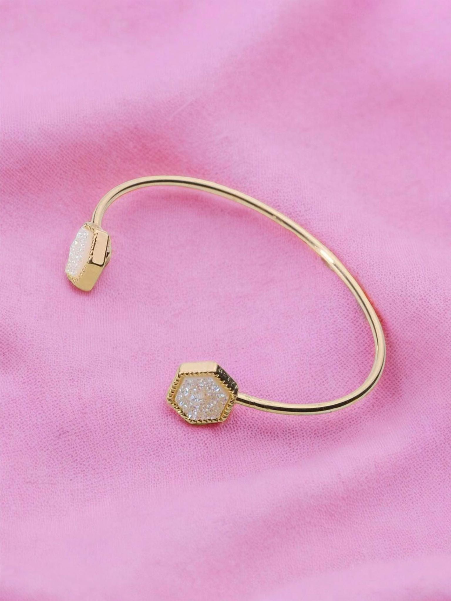 ENCHANTED Cuff Bracelet by Teal Tiger Boutique $14.00 This KS-inspired cuff bracelet is absolutely stunning with a sparkling hexagon-shaped stone set in a beautiful gold tone. You will be enchanted by its charm and beauty. Teal Tiger Boutique