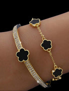 GOOD FORTUNE Bracelet Set by Teal Tiger Boutique $18.00 Welcome to the GOOD FORTUNE Bracelet Set, featuring two gorgeous bracelets. The first is a rhinestone-encrusted bangle with a golden clover-shaped stone, while the second is a black clover-adorned ch