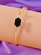 SPARKLING SABLE Bracelet by Teal Tiger Boutique $14.00 This bracelet features a lovely sable-colored geometric stone, and is adorned with a KS-inspired gold tone bangle and hook closure. Teal Tiger Boutique