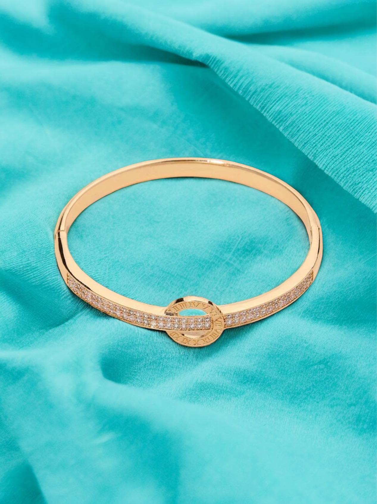 MOMENT IN TIME Bracelet (gold tone) by Teal Tiger Boutique $16.00 The carefully crafted MOMENT IN TIME Bracelet in gold tones features a stunning sundial design, accented with sparkling inlaid rhinestones, for a truly elegant and timeless accessory. T ins