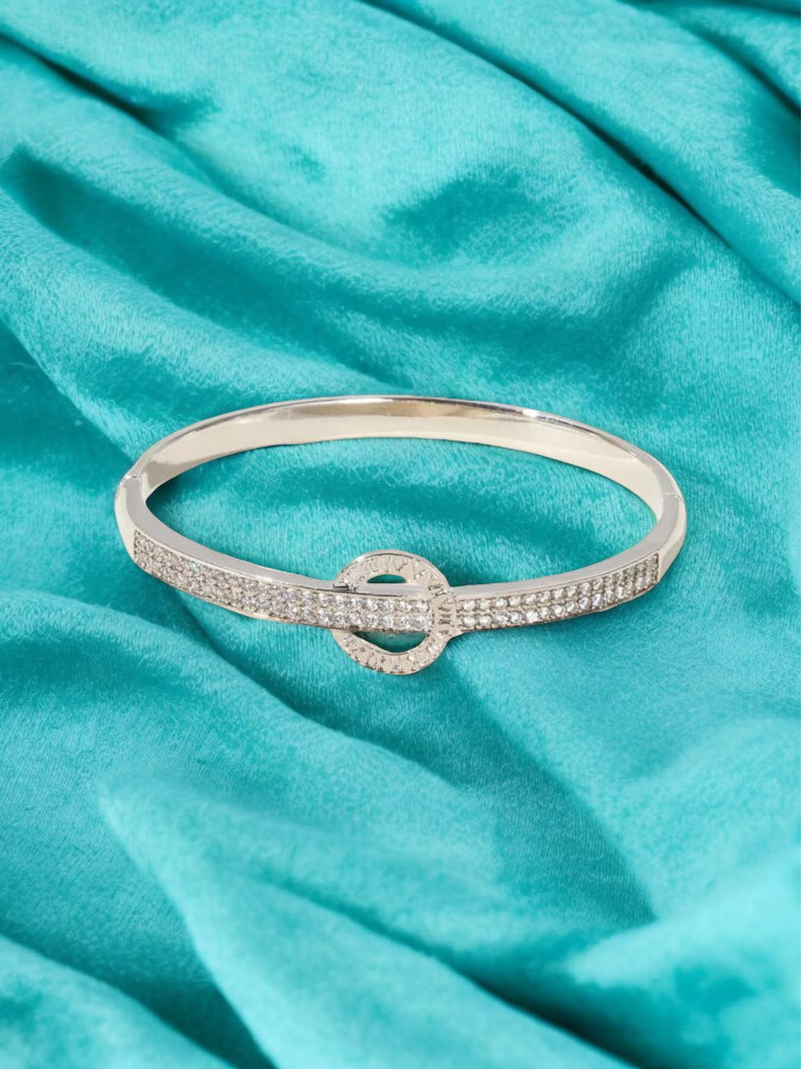 MOMENT IN TIME Bracelet (silver tone) by Teal Tiger Boutique $16.00 The carefully crafted MOMENT IN TIME Bracelet in silver tone features a stunning sundial design, accented with sparkling inlaid rhinestones, for a truly elegant and timeless accessory. T