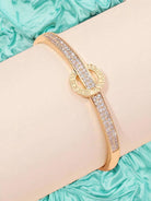 MOMENT IN TIME Bracelet (gold tone) by Teal Tiger Boutique $16.00 The carefully crafted MOMENT IN TIME Bracelet in gold tones features a stunning sundial design, accented with sparkling inlaid rhinestones, for a truly elegant and timeless accessory. T ins