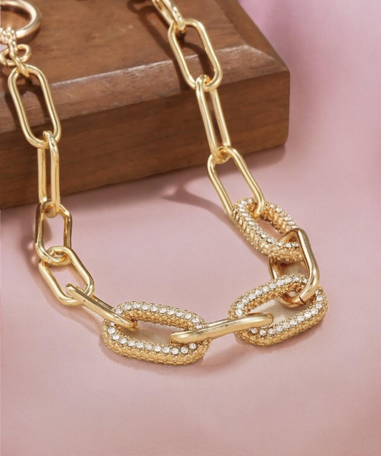 FOREVER LINKED Bracelet (Gold Tone) by Teal Tiger Boutique $14.00 The beautiful Forever Linked chain link style bracelet boasts a gold tone with sparkling rhinestone accents and a convenient toggle clasp. Teal Tiger Boutique