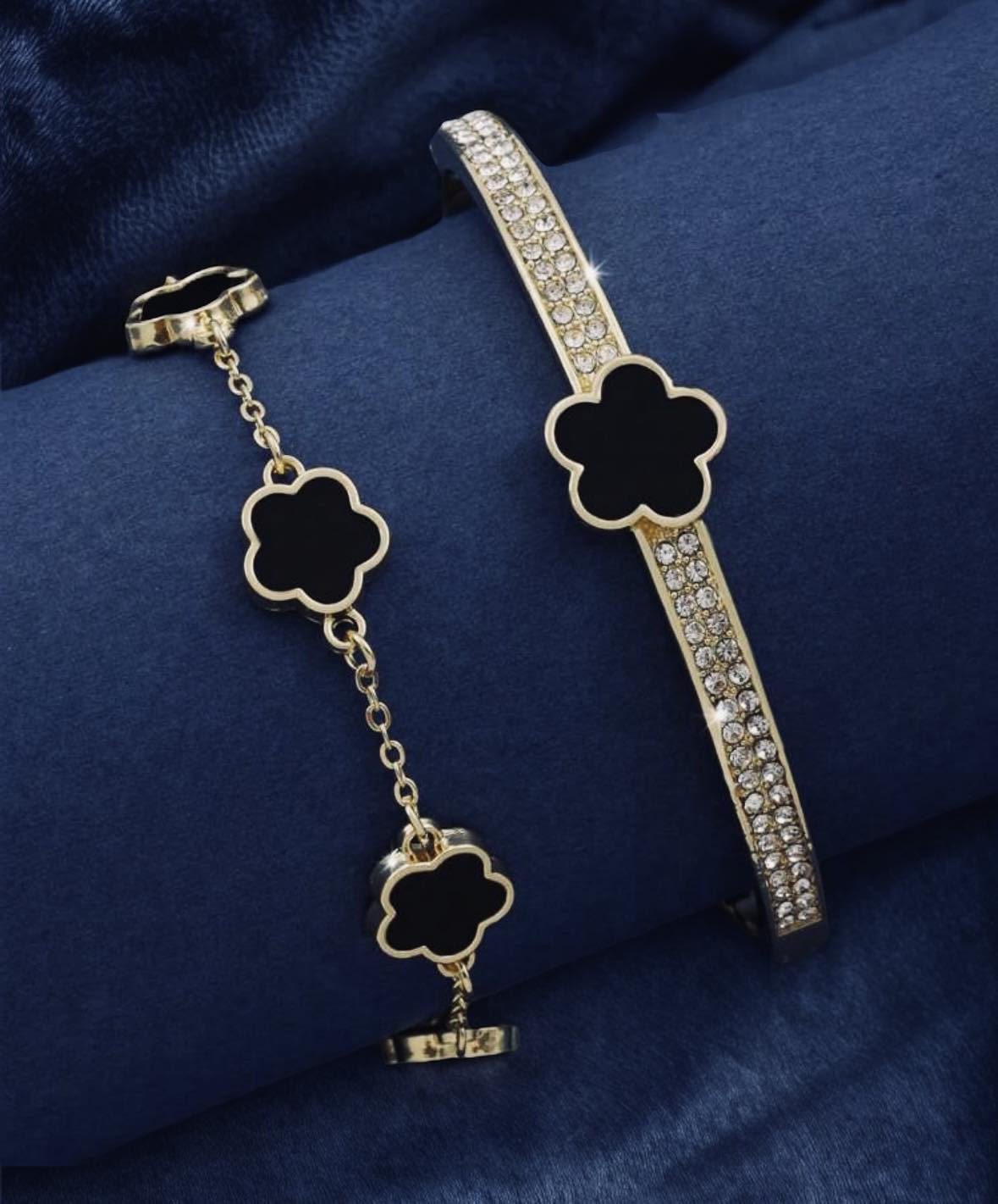 GOOD FORTUNE Bracelet Set by Teal Tiger Boutique $18.00 Welcome to the GOOD FORTUNE Bracelet Set, featuring two gorgeous bracelets. The first is a rhinestone-encrusted bangle with a golden clover-shaped stone, while the second is a black clover-adorned ch