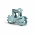 DAILY DARLING BOW HAIR CLIP (6 colors) in blue, features a modern bow design and smooth matte finish for stylish hairdos.