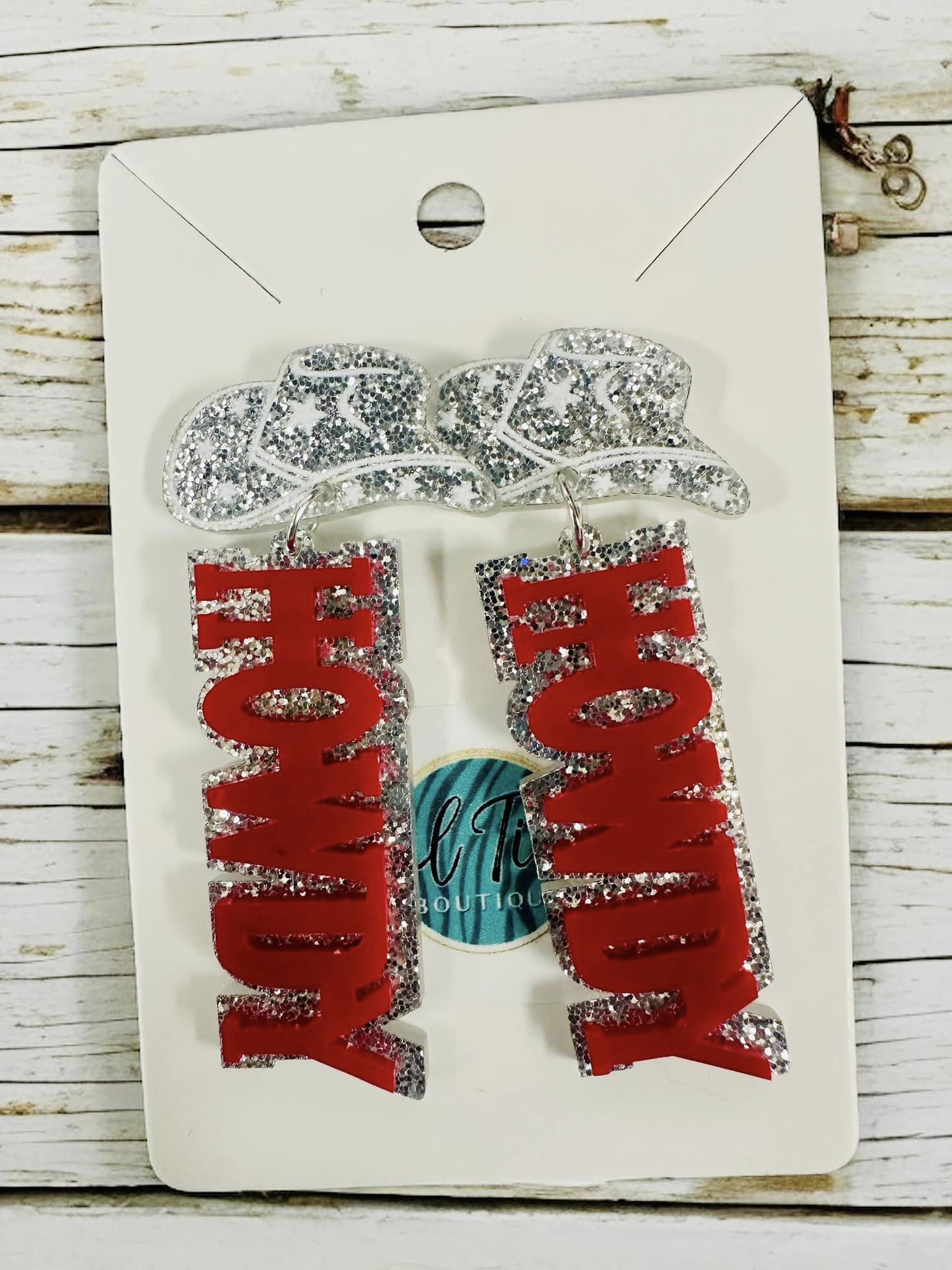 Howdy Earrings featuring red lettering and sparkling silver cowboy hats, perfect for western-themed events.