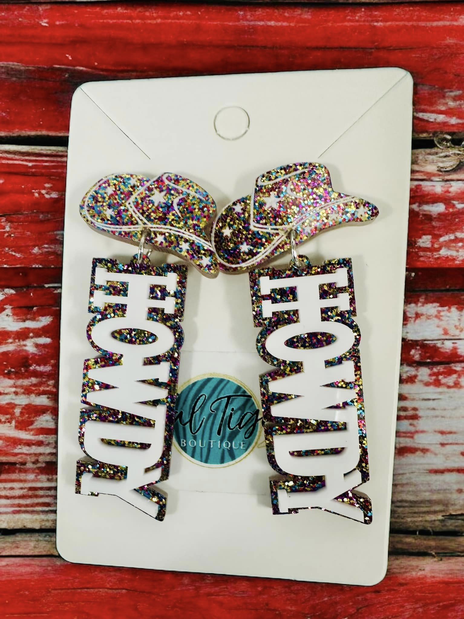 Sparkly Howdy Earrings with cowboy hats, perfect for western style and rodeos. Colorful, stylish, and eye-catching accessory.