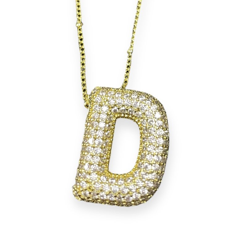 Gold tone rhinestone-encrusted initial 'D' necklace on a delicate chain, perfect for personalized gifting.