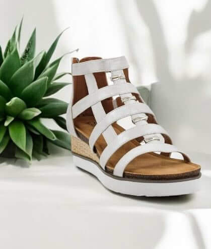 Corkys Caged Wedge Sandals in white with faux leather straps and cork wedge heel.