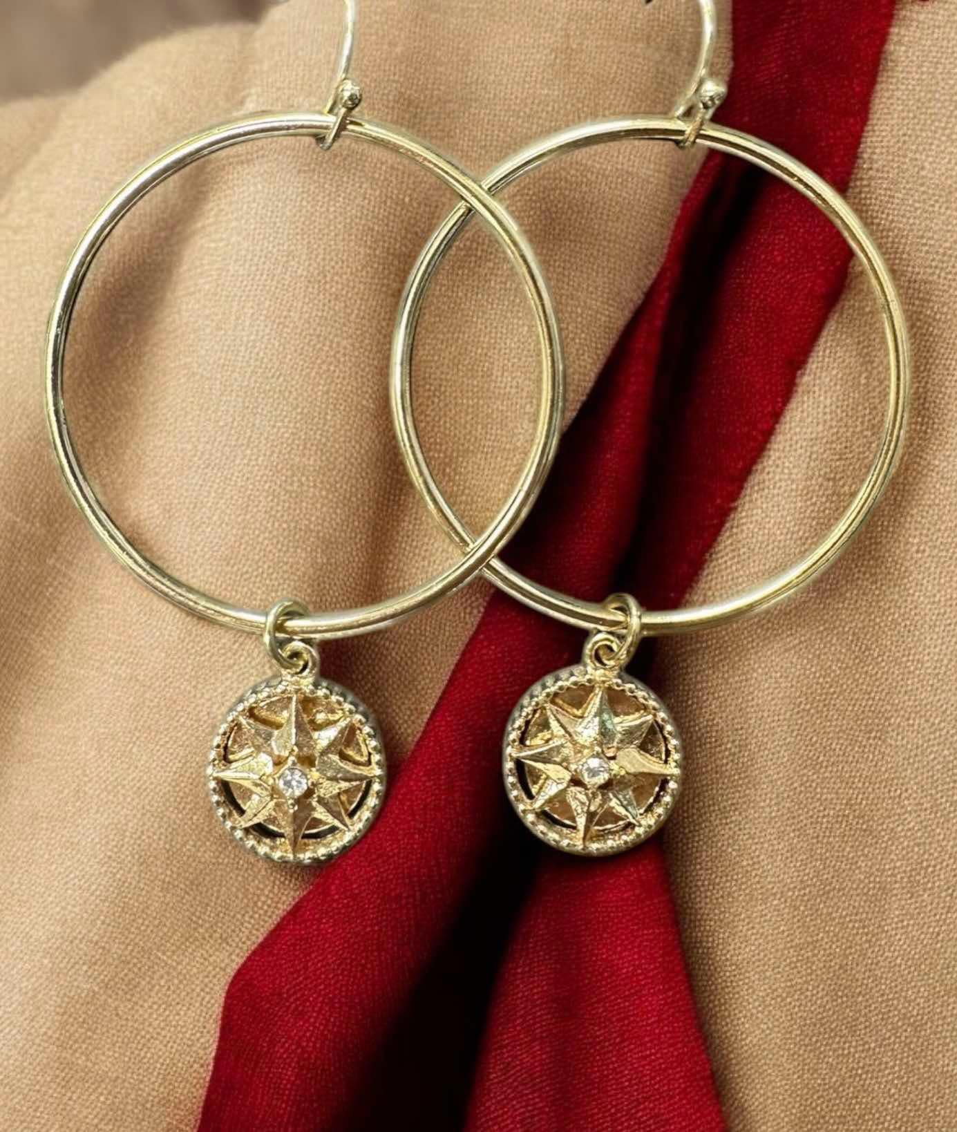 Natural Balance Earrings with gold-tone circles and rhinestone-star centers, featuring French hook style for elemental elegance.