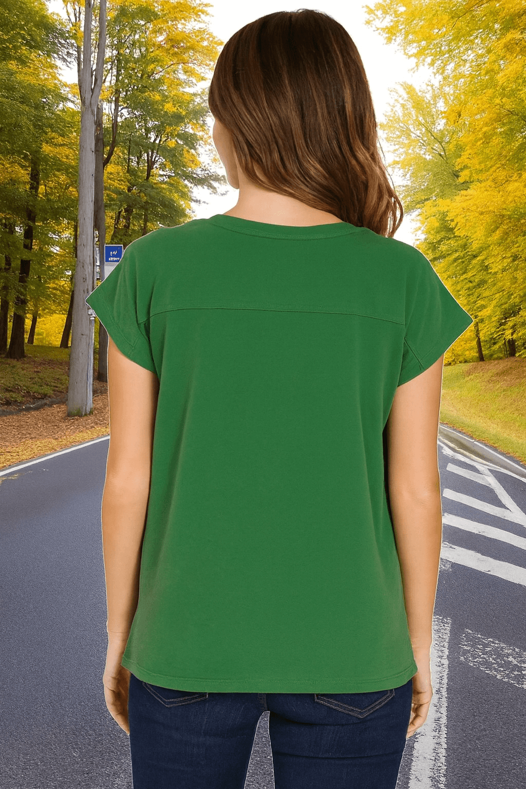 Back view of the Woodland Whisper Tee in green, showcasing its relaxed fit and folded short sleeves.