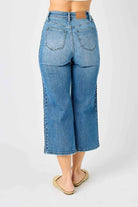 Judy Blue Braided Betty Jeans with unique braided detailing and wide leg silhouette, back view.