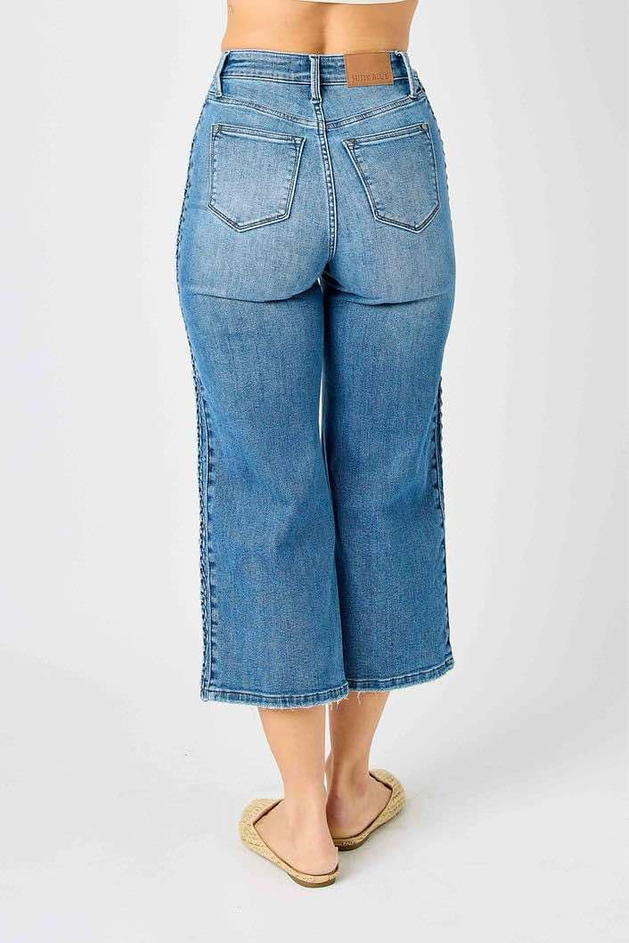 Judy Blue Braided Betty Jeans with unique braided detailing and wide leg silhouette, back view.