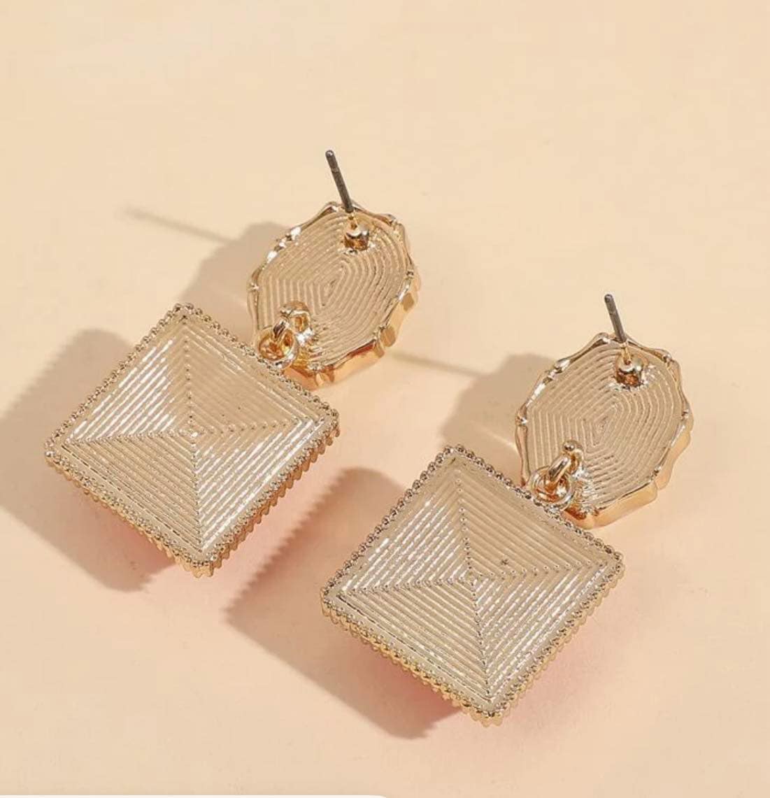 Stylish gold-toned drop earrings with textured square design and delicate top stud.