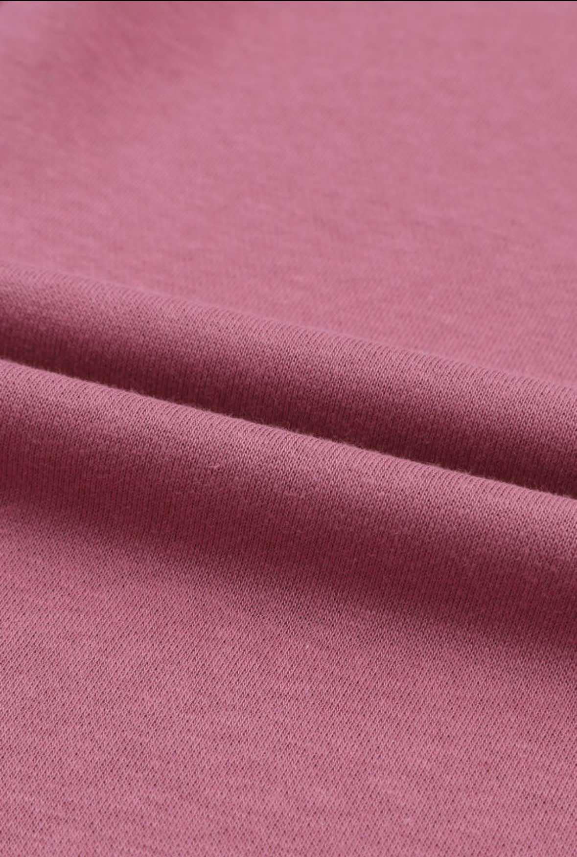 Close-up of the soft mauve fabric of the Lasting Friendship top, showcasing its cozy texture and relaxed fit.