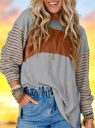 Soft oversized BLOCK PARTY TOP in smoke gray and rust, featuring stylish stripes and a contemporary colorblock design.