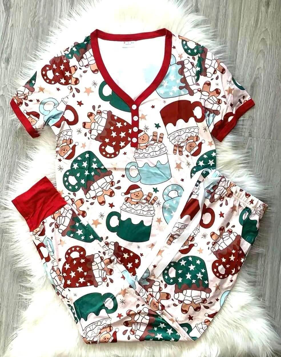 Cocoa and gingerbread holiday pajamas with gingerbread men in cocoa cup design, featuring jogger bottoms and short sleeve top.