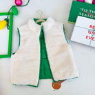 Emerald Aura Reversible Vest by Love Tree, featuring soft off-white sherpa and vibrant emerald green interior.