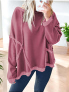 Stylish mauve Lasting Friendship top with exposed seam design, paired with black leggings, perfect for a relaxed look.