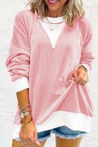 Casual pale pink textured top with color block design, showcasing relaxed style and drop shoulder fit. Perfect for all body types.