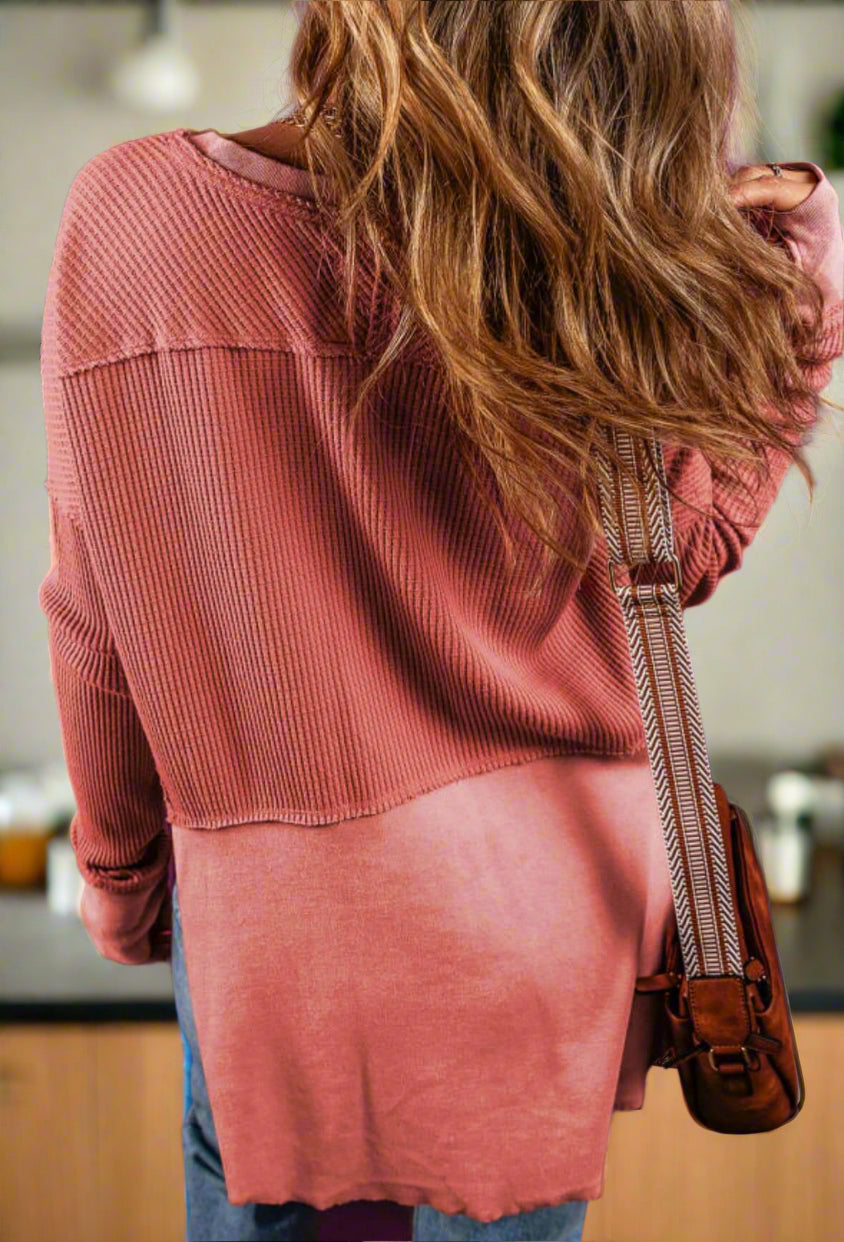 Model showcasing the back of the Hold My Hand Top in Mineral Red against a purple background.