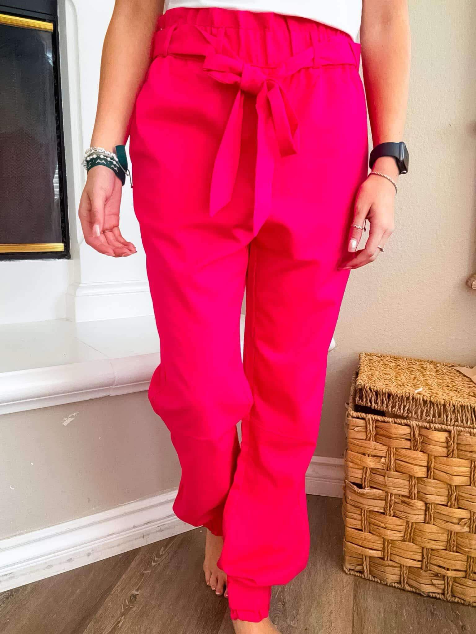 Adorable Pink Power Joggers with elastic waist and cute belt, perfect for any casual occasion.