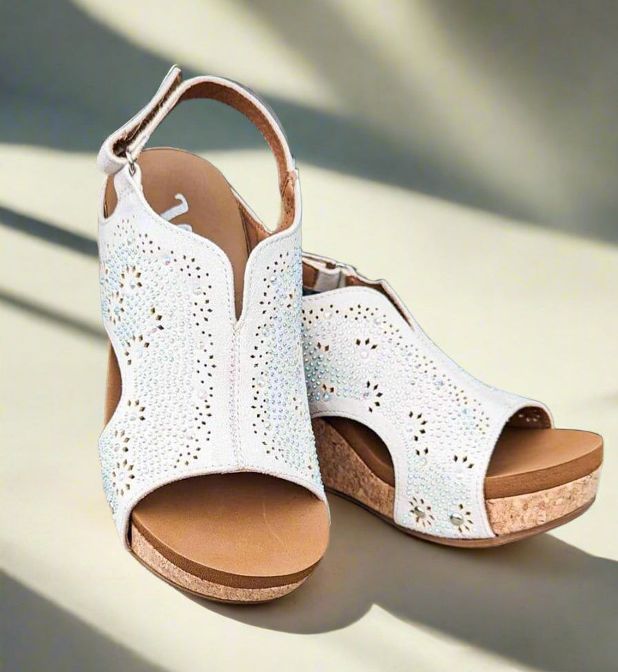 Very G Starry Nights white wedge sandals with laser cut details and studded accents on cushioned cork sole.