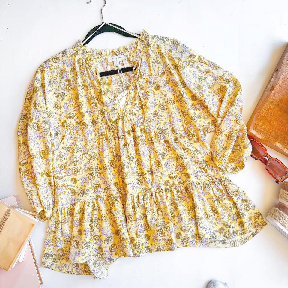 Floral Golden Hour Garden Top by Umgee in yellow and lavender hues, featuring ruffled neckline and peplum hem.