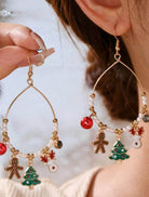 Festive gingerbread and Christmas tree earrings with charms, faux pearls, and gold tone beads for holiday cheer.