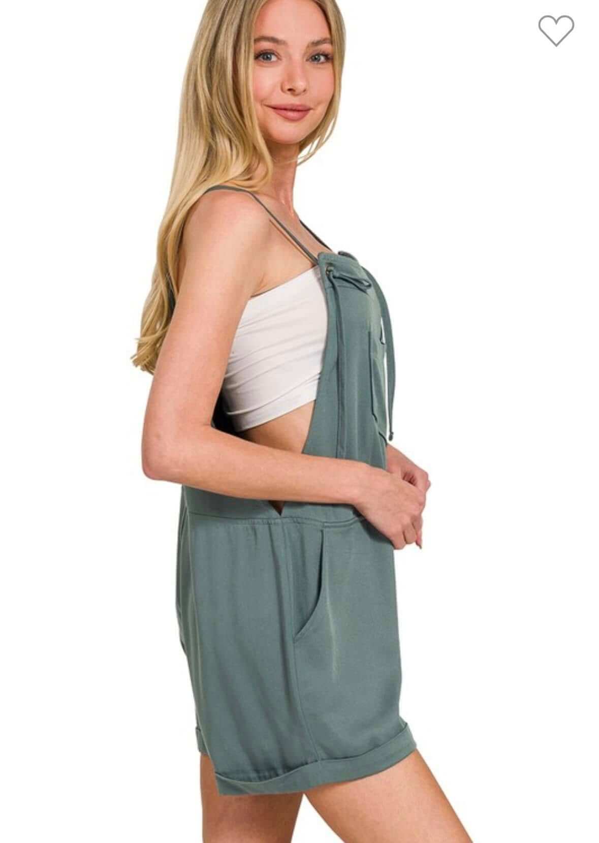 Model showcasing the ZENANA Tell Me Romper in ash jade with tie knot straps.