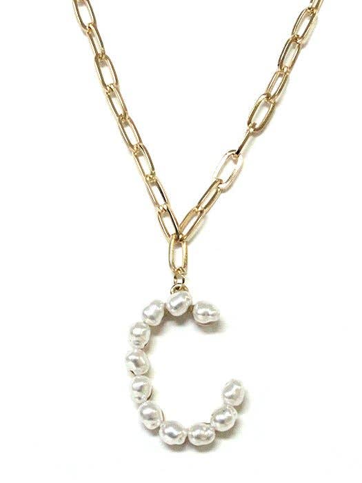 Pearl Essence Monogram Necklace by Avenue Zoe with gold-tone chain and freshwater pearl letter pendant.