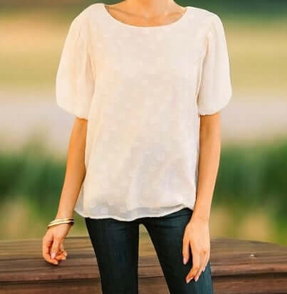 Stylish Umgee Pointed Conversations Top in light color, featuring puff sleeves and playful texture.