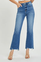 Risen Nora Jeans featuring a relaxed straight fit, medium dark wash, and frayed hem for a stylish look.