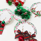 Christmas Theme Dangle Earring Set featuring festive designs including bows, bells, and holiday colors.