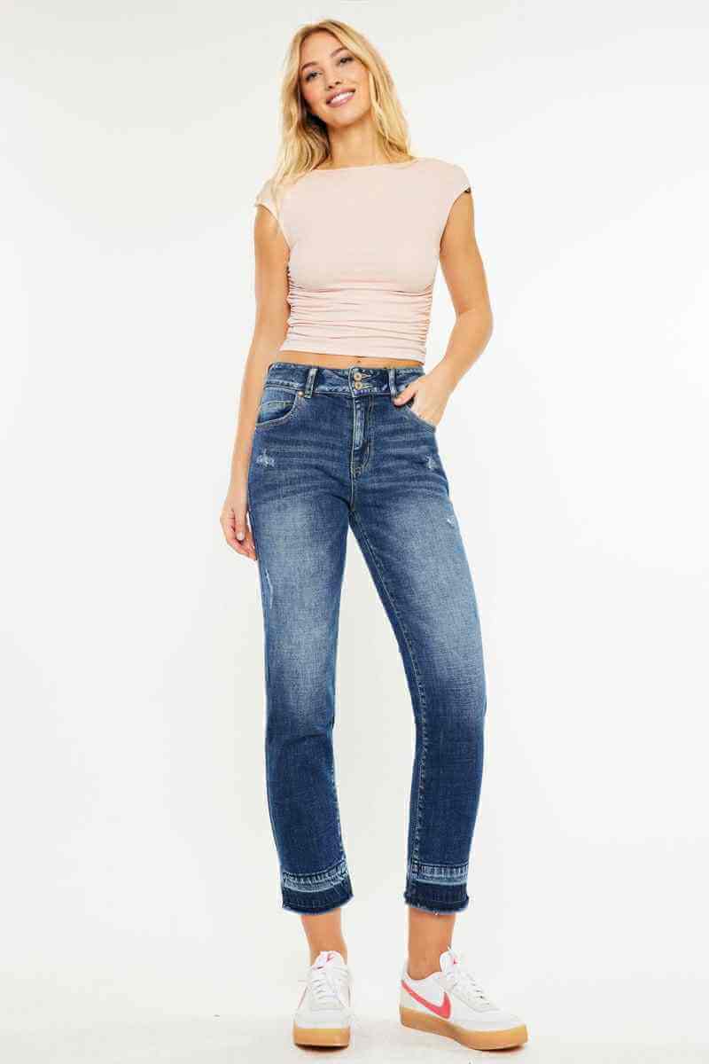 Model wearing KANCAN Georgia Ultra High Rise Slim Straight Leg Jeans with a light top and sneakers.