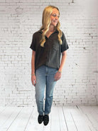 Model wearing the Midnight Mist top by Umgee; casual style with button-down design, V neckline, and frayed hem.