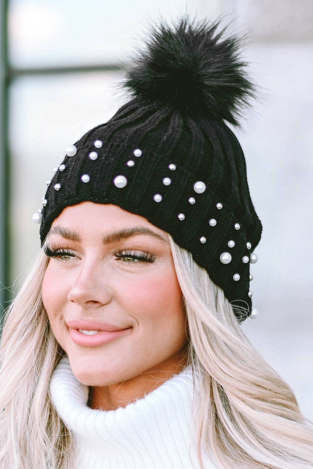 PEARL ESSENCE BEANIE by Lovesoft $10.00 Stunning pearl look beanie for a touch of elegance to any outfit. The playful pom pom adds a pop of fun and trendiness. The cuff design ensures a cozy and snug fit while the knit construction provides warmth and com