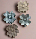 Houndstooth flower claw clips from the Crystal Collection by UP, showcasing four chic colors and patterns.