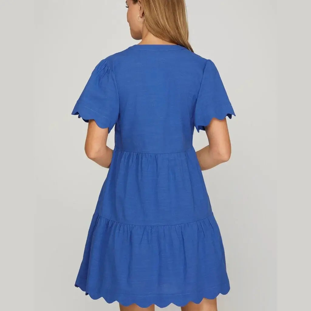 Back view of the Cobalt Blue Coastal Curves Dress featuring scalloped sleeves and hem.