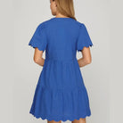 Back view of the Cobalt Blue Coastal Curves Dress featuring scalloped sleeves and hem.